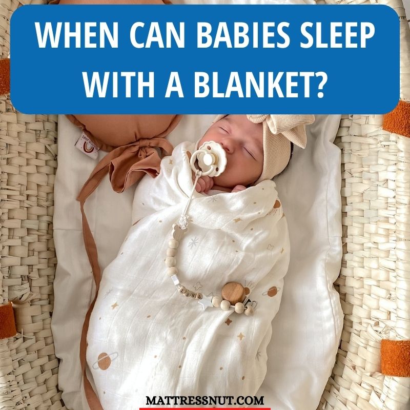 When can babies sleep with a blanket