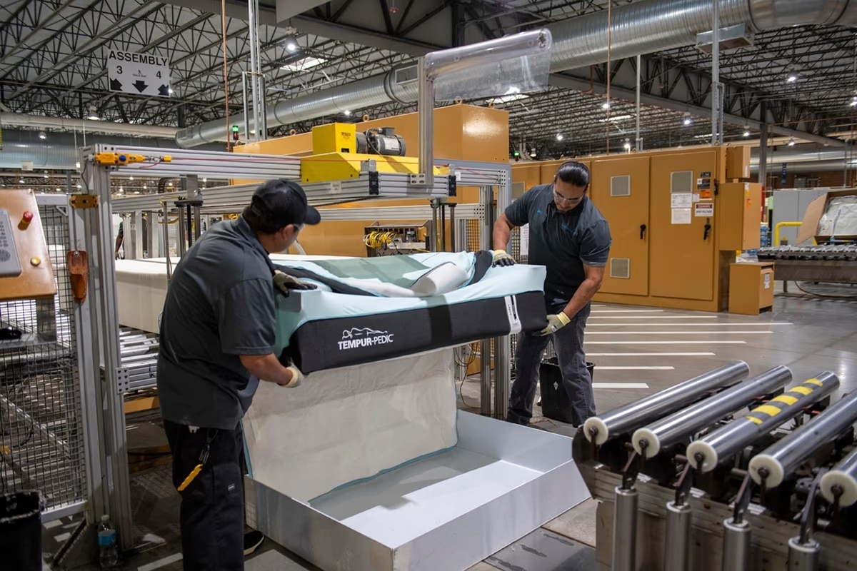 Interior shot of Tempur Pedic's advanced manufacturing plant with mattresses in production